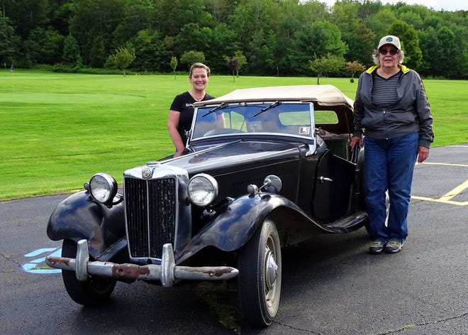 Martha “Marty” Demmer is shown in this photo with navigator/co-driver Celese Castrogiovanni as they ready to take Marty’s fabulous, all-original 1952 MG-TD Mark II for a ride. [Photo by Rebecca Severcool]