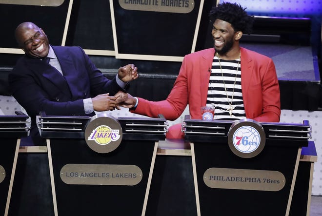 (File) The 76ers' Joel Embiid (right) shared a laugh with Lakers president of basketball operations Magic Johnson during the May 16 NBA Draft Lottery in New York.