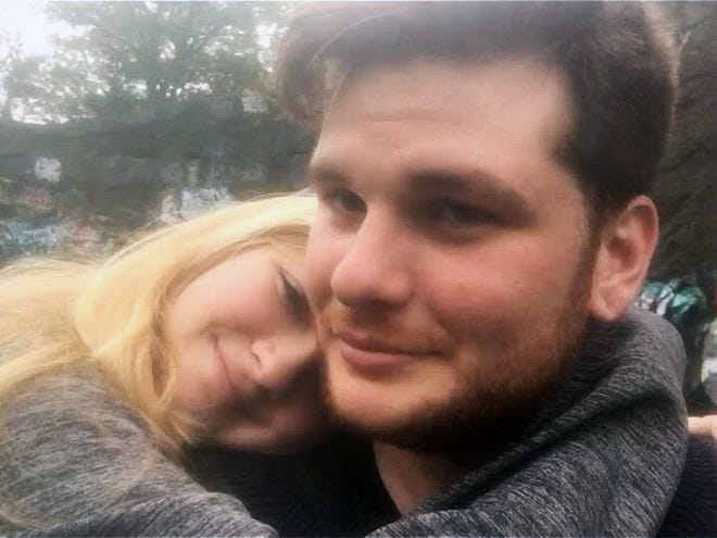 This undated photo provided by Kianna Kaizer, shows Jeremy Himmelman and his girlfriend Kianna Kaizer. Himmelman was fatally shot along with his friend Andrew Oneschuk, 18, by a roommate in the Tampa apartment the men all shared. The friends met through an obscure neo-Nazi group called Atomwaffen Division. After his arrest for the shooting, roommate Devon Arthurs told police that he killed Himmelman and Oneschuk because they along with Atomwaffen’s leader Brandon Russell were planning to bomb synagogues, nuclear facilities and other sites. (Kianna Kaizer via AP)
