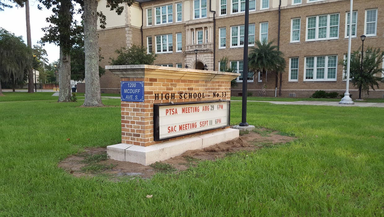 Why Robert E. Lee's name is missing from the sign at this Jacksonville high  school