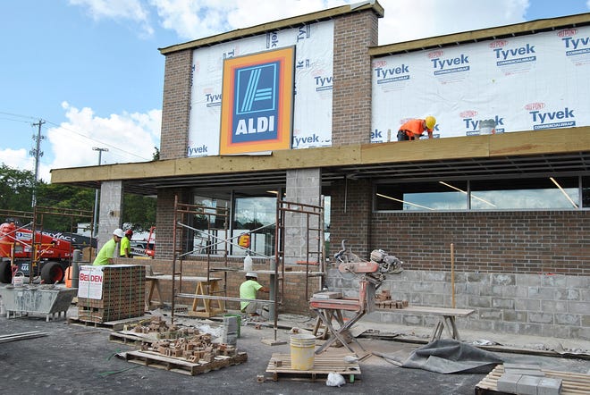 Construction crews are hurrying to complete the facelift at the 24th Street Aldi in Holland. The store is set to host a grand opening event on Thursday, August 31, 2017. [Austin Metz/Sentinel Staff]