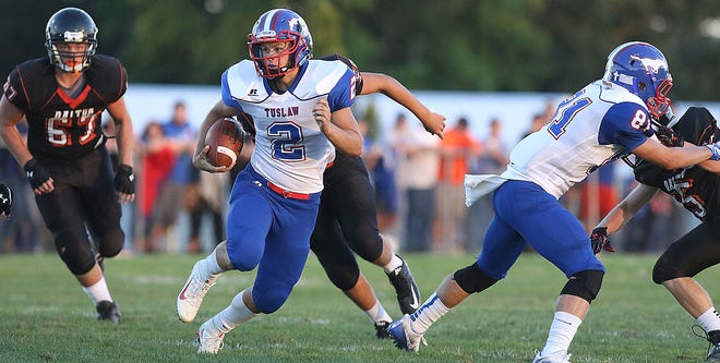 Tuslaw QB Chase Woods runs the ball during a game with Dalton during the 2016 season.

(IndeOnline.com / Kevin Whitlock)