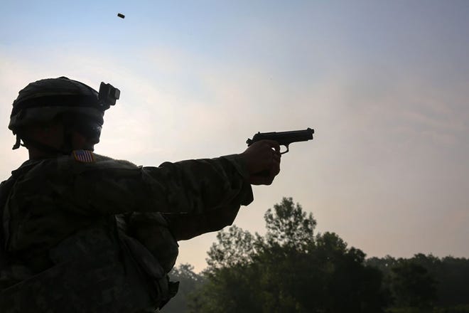 U.S. Army Sgt. Luis Cruz fires a M9 pistol during the 2017 Army Materiel Command's Best Warrior Competition July 18, 2017, at Camp Atterbury, Indiana. The Army's new modular handgun, the XM17 and XM18 will be fielded by the 101st Airborne Division at Fort Campbell, Kentucky, in November.