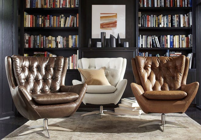 AP PHOTO/PATTERY BARN VIA AP The Wells swivel chair by Pottery Barn. With a nod to mid-century modern style, the Wells swivel chair incorporates classic detailing like tufting and the wing silhouette.