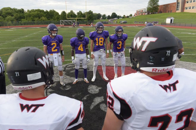 Upper Moreland and William Tennent football captains meet for the official coin toss before a game Friday, August 25, 2017.