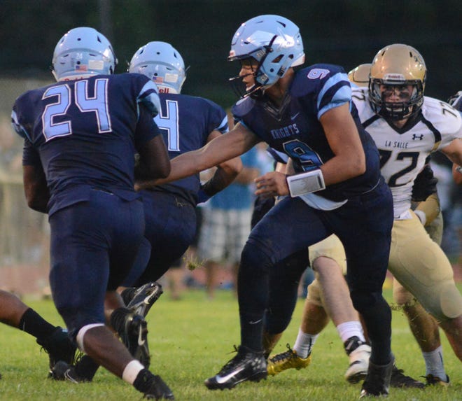 North Penn's Joey Slover (24) receives a handoff from quarterback Steve DePaul (9) in the second quarter of the Knights' game against La Salle High School Friday Aug. 25, 2017 at North Penn High School in Towamencin.