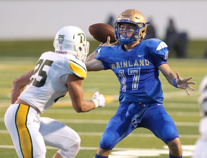 Mainland quarterback Jake Novello (17) looks to pass during a game with DeLand at Municipal Stadium in Daytona Beach, Friday, August 25, 2017. [News-Journal/Nigel Cook]