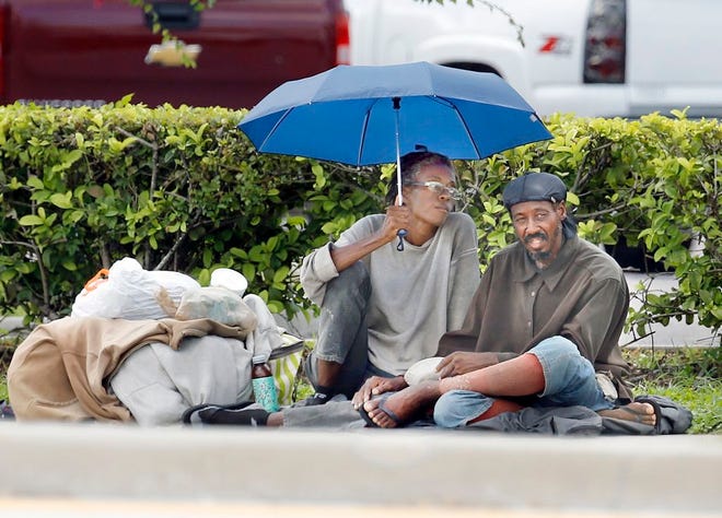 Tabitha Drake and Jeffrey McGinty, a homeless couple, are camped along Van Fleet Drive in Bartow.