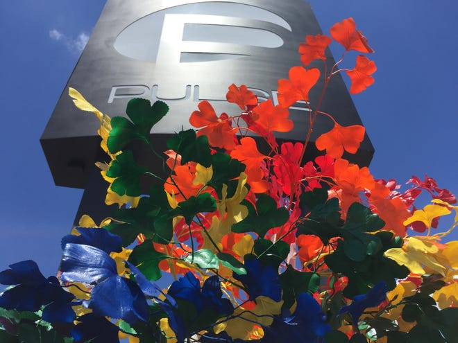 Image showing flowers near the iconic sign at the Pulse Nightclub in Orlando. Florida's state police agency says it did many things right in responding to a 2016 mass shooting at an Orlando nightclub, but could have done better at identifying victims and notifying their surviving relatives, according to an internal review released Friday. [GATEHOUSE MEDIA FILE]