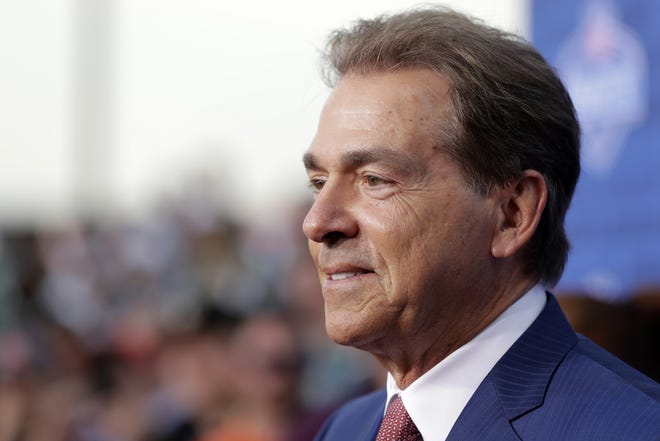 Even Nick Saban smiles at the thought of football season approaching. Just kidding, this photo was taken in the spring, during his annual attempts at smiling. [Associated Press File]