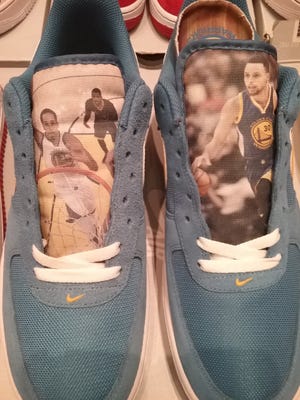 NICK VLAHOS/JOURNAL STAR

An example of sneakers artwork by East Peoria-based Justin Fenwick. These shoes feature two Golden State Warriors basketball players -- Stephen Curry, right, and Peoria High School graduate Shaun Livingston.