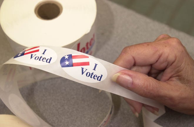 A November 2000 file photo of "I Voted" stickers ready for voters after they cast ballots. A coalition of activist groups is working to gather enough signatures to place a constitutional amendment on the Florida ballot that would automatically restore voting rights for most felons — murderers and sex offenders excluded — after they complete the terms of their sentence. [H-T ARCHIVE]