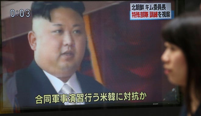 A woman walks past a TV news program showing footage of North Korean leader Kim Jong Un, in Tokyo, Saturday, Aug. 26, 2017. Three North Korea short-range ballistic missiles failed on Saturday, U.S. military officials said, which, if true, would be a temporary setback to Pyongyang’s rapid nuclear and missile expansion. Japanese letters at top right read: “North Korean leader Kim inspected a special operation forces training.” (AP Photo/Koji Sasahara)