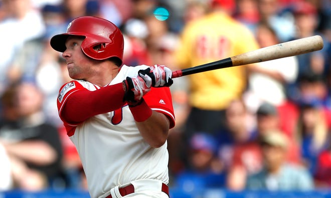 Philadelphia Phillies' Rhys Hoskins follows through on a home run in the eighth inning of a baseball game against the Chicago Cubs, Sunday, Aug. 27, 2017, in Philadelphia. (AP Photo/Laurence Kesterson)