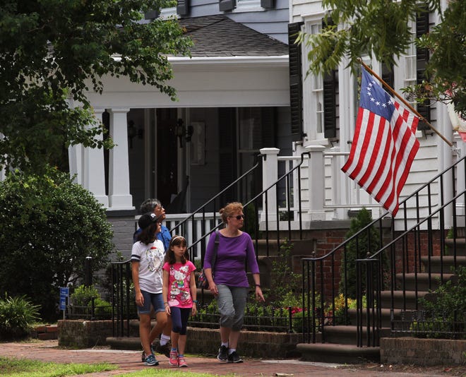 Roberta Lawrence, Devyn Irizawa, 9, Sachi Irizawa, 13, and Frank Irizawa tour the historic district of Pollock Street in New Bern. The family group is traveling from Maryland. Tourism spending in Craven County increased in 2016, the seventh straight year in which it has increased. [GRAY WHITLEY / SUN JOURNAL STAFF]