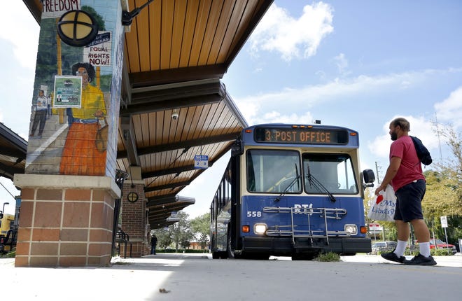 A rider gets ready to board a Regional Transit System bus at the downtown RTS bus station in Gainesville on Thursday. So far in 2017, RTS has logged 6.8 million riders, which is on pace to be lower than the 2016 figures. [Brad McClenny/Staff photographer]