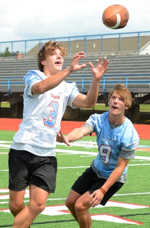 Southside receiver Brenden Ulrich, left, and linebacker Heabren Ulrich are often matched up during practice. The twins will be playing in their senior year for the Mavericks. [BRIAN D. SANDERFORD/TIMES RECORD]