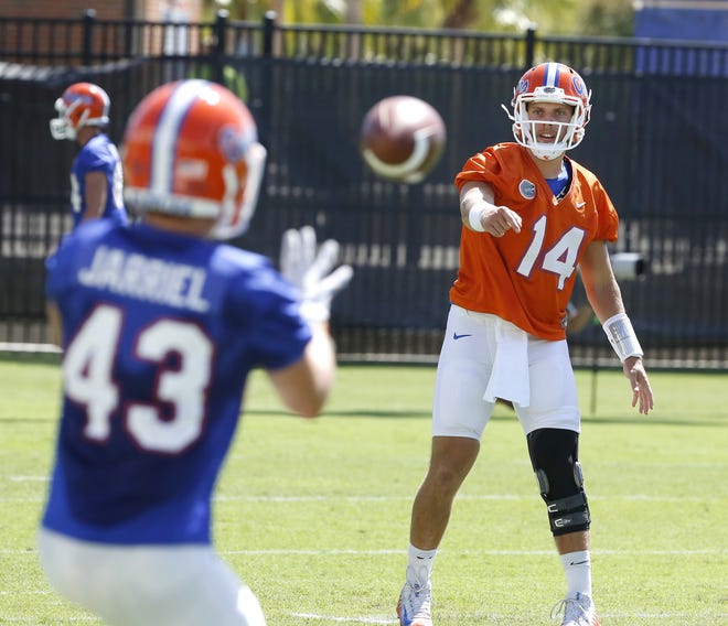 Florida quarterback Luke Del Rio (14) throws during a Gator football practice in Gainesville last week. Florida coach Jim McElwain is not revealing his plans for quarterback ahead of Saturday's game against Michigan. [Brad McClenny / Gatehouse Media]
