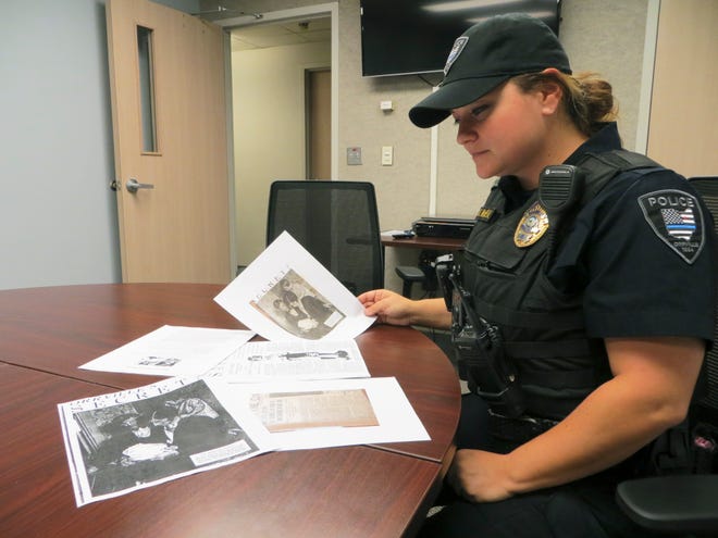 Orrville Police Sgt. Jaime McGreal pores over old files related to the 1928 disappearance of Melvin Horst, a case which has never been solved. McGreal is employing new technology to place DNA from Horst family members on file with Project LINK, in hopes of someday identifying Horst's remains if they are found.