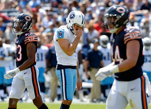 Tennessee Titans kicker Ryan Succop hangs his head after missing a 40-yard field goal attempt against the Chicago Bears in the first half of an NFL football preseason game Sunday, Aug. 27, 2017, in Nashville, Tenn. Walking to the sideline are Bears defenders Kyle Fuller (23) and Nick Kwiatkoski (44). (AP Photo/Mark Zaleski)