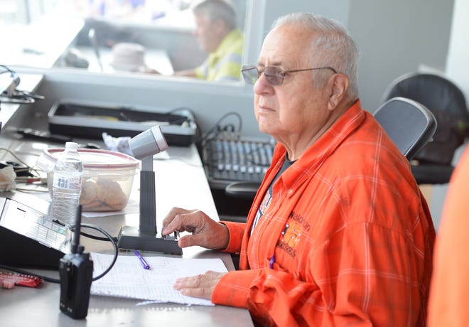 Fritz Morales, Waldron's longtime public address announcer, works from the press box during a track meet held at the school in April. [BRIAN D. SANDERFORD/TIMES RECORD]