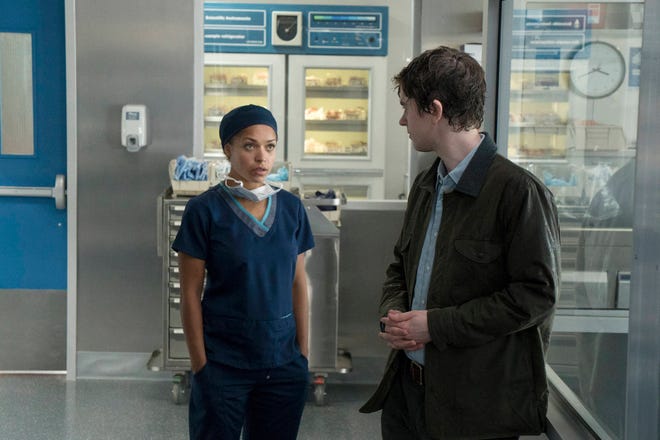 This image released by ABC shows Antonia Thomas, left, and Freddie Highmore in a scene from “The Good Doctor,” premiering Sept. 25, on ABC. (Liane Hentscher/ABC via AP)