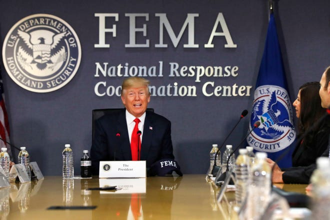 FILE - In this Aug. 4, 2017 file photo, President Donald Trump speaks at Federal Emergency Management Agency (FEMA) headquarters in Washington. The federal government has, for now, enough disaster aid money to deal with the immediate aftermath of Hurricane Harvey, but the ongoing storm appears sure to require a multibillion-dollar recovery package as did Hurricane Katrina and Superstorm Sandy. (AP Photo/Jacquelyn Martin, File)
