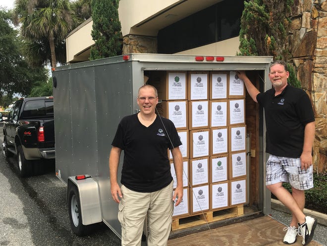 Bob Bostic, executive director of Deliver the Difference, and Duaine Deason, hometown programs coordinator, stand in front of a trailer loaded with meals for those affected by Hurricane Harvey and the flooding in Houston. [SUBMITTED]