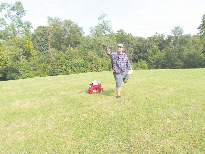 Brad Lescalleet takes a shot at Whispering Falls Disc Golf Course at Antrim Township Community Park. For video, visit echo-pilot.com.