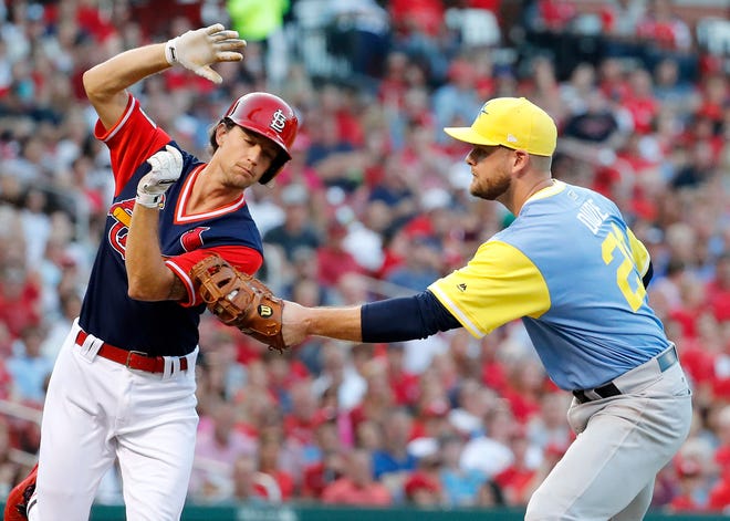 St. Louis Cardinals' Mike Leake, left, is tagged out by Tampa Bay Rays first baseman Lucas Duda on a sacrifice bunt during the third inning of a baseball game Saturday, Aug. 26, 2017, in St. Louis. (AP Photo/Jeff Roberson)