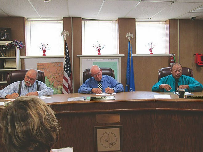 Osage County Commissioners sign the payroll agreement during their Monday regular meeting at the Osage County Courthouse.

Nathan Thompson/Journal-Capital