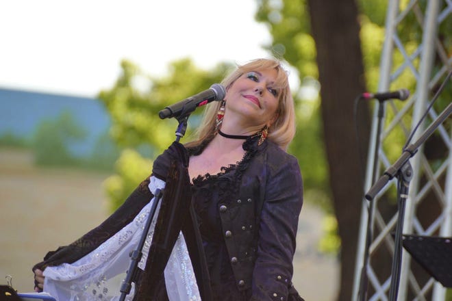 Marirose Powell as Stevie Nicks sings some of the darker songs with Mystic Moon -- A Fleetwood Mac Tribute, which performs today at the Downtown Lodi Farmers Market. [COURTESY]