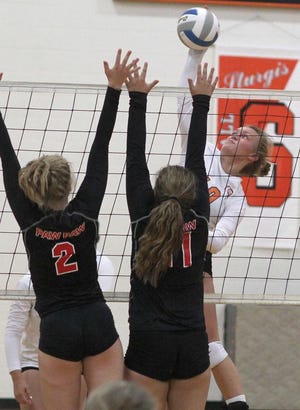 Hannah Bronstetter of Sturgis powers home a kill against Paw Paw in the Lady Trojan win on Wednesday.