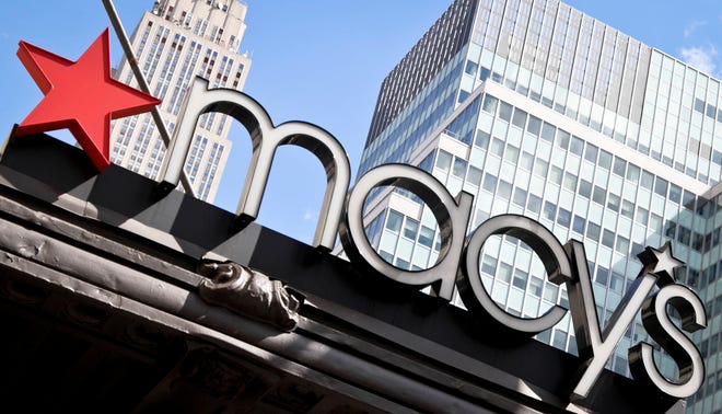 This Tuesday, May 2, 2017, photo shows Macy’s corporate signage at its flagship store in New York. Macy’s and Best Buy are expanding their same-day delivery as they aim to become more competitive with online leader Amazon. (AP Photo/Bebeto Matthews)