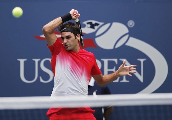 Roger Federer, of Switzerland, returns a shot from Mikhail Youzhny, of Russia, during the second round of the U.S. Open tennis tournament, Thursday, Aug. 31, 2017, in New York. (AP Photo/Andres Kudacki)