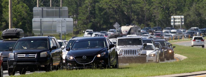 Traffic backs up near the Mid-Bay Bridge in Bluewater Bay. [FILE PHOTO/DAILY NEWS]