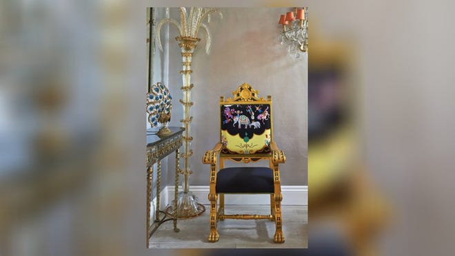 A chair is upholstered in the Circus Scarf designed by Carleton Varney featuring elephants, horses and clowns. Photo by Michel Arnaud, courtesy of Dorothy Draper & Co.