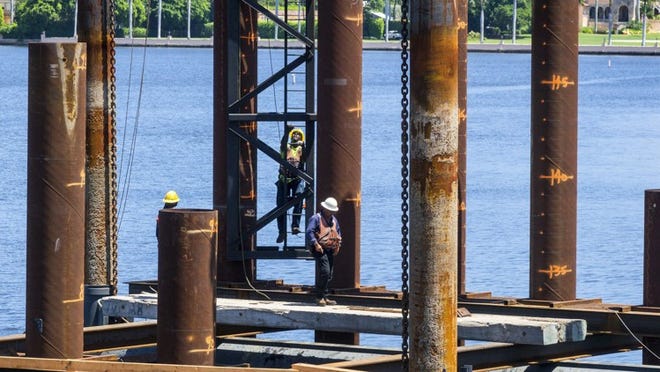 Work is in full progress on the $93 million replacement of the Southern Boulevard Bridge on Aug. 30, 2017. A temporary bridge is being built north of the existing Southern Blvd. bridge before construction on the new drawbridge begins. Mar-a-Lago is in the background, at right. (Lannis Waters / Daily News)