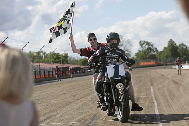 Bryan Smith (1) of Swartz Creek, Michigan, on an Indian Scout FTR750 takes his crew chief for a victory lap after his win during The American Flat Track Harley-Davidson Springfield Mile on Sunday, May 28, 2017. Photo by Jason Johnson.