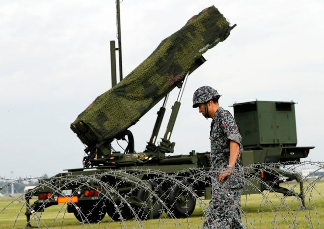 Japanese Air Self-Defense Force (JASDF) demonstrates the training to utilize the PAC-3 surface to air interceptors at the U.S. Yokota Air Base in Fussa, on the outskirts of Tokyo. Japan is debating whether to develop limited pre-emptive strike capability and buy cruise missiles - ideas that were anathema in the pacifist country before the North Korea missile threat.