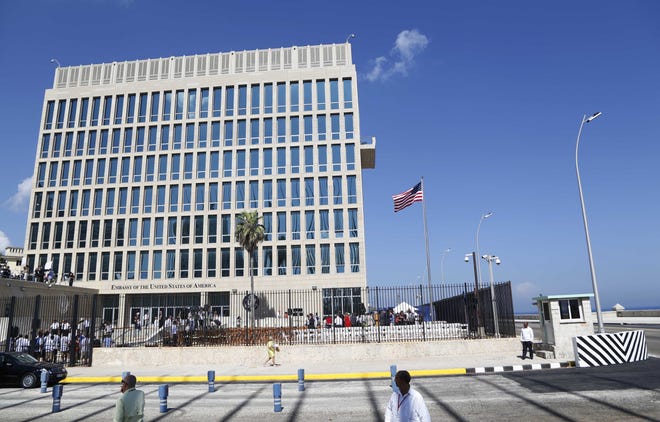 A U.S. flag flies at the U.S. embassy in Havana, Cuba, on Aug. 14, 2015. American diplomats who served in Cuba have been diagnosed with mild traumatic brain injury following mysterious, unexplained attacks on their health, the union that represents U.S. diplomats said Friday. [DESMOND BOYLAN/THE ASSOCIATED PRESS]