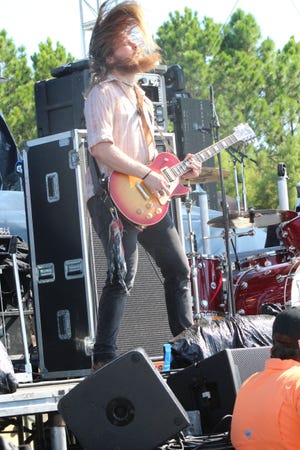 Them Dirty Roses plays a set at Gulf Coast Jam. [ERYN DION/THE NEWS HERALD]