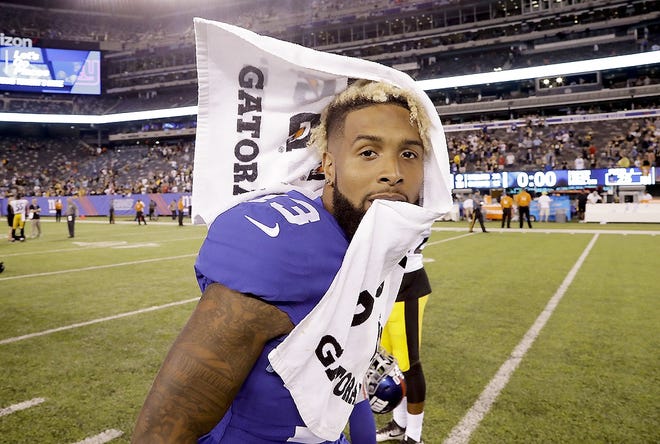 In this Aug. 11 file photo, New York Giants wide receiver Odell Beckham walks off the field after a preseason NFL football game against the Pittsburgh Steelers, in East Rutherford, N.J. The New York Giants are keeping everyone guessing about their star receiver’s status for the season opener against Dallas. [JULIO CORTEZ/ASSOCIATED PRESS]
