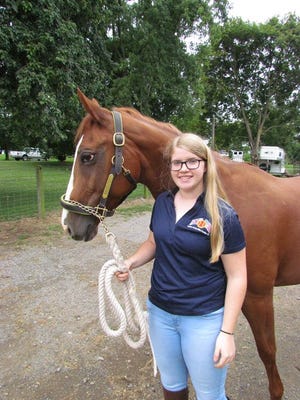 Emma Jacobs and her horse, Brumby, are shown at Welsh Run Stables after returning from the FEI Children's Dressage National Final near Chicago.