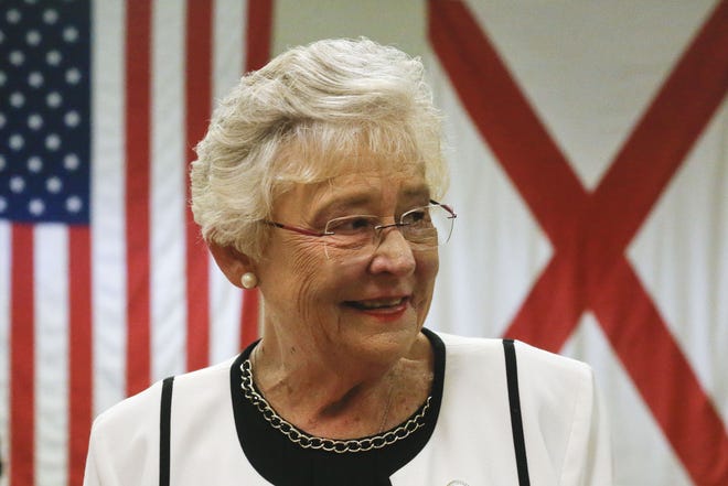 Gov. Kay Ivey stands in front of the United States flag and the Alabama state flag as she tours educational facilities in Tuscaloosa on Aug. 30, 2017. [Staff Photo/Gary Cosby Jr.]