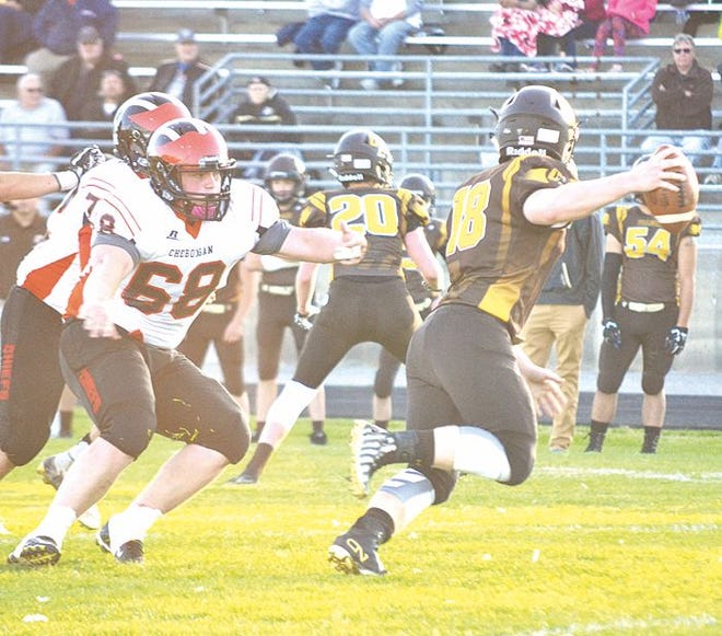 Cheboygan senior defensive lineman Gavin Speed (68) chases down Ogemaw Heights quarterback Colin Stahl during a game in West Branch on Aug. 31. Fresh off a 26-7 win over the Falcons, the 1-1 Chiefs will have a stiff challenge when they host 2-0 Boyne City at Western Avenue Field on Friday at 7 p.m.