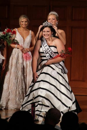 The 2017 Prime Beef Festival Princess Grace Louessa Young, daughter of April and Bryan Young of Monmouth is crowned by the 2016 Princess Sydney Killey on Saturday at Monmouth College Dhl Chapel. [Ruth Kenney/GateHouse Media Illinois]