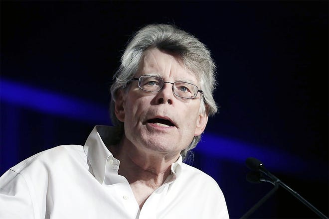 In this June 1 photo, author Stephen King speaks at Book Expo America in New York. King discussed in an interview with The Associated Press how he views Hollywood adaptations of his writings, including the upcoming film "It," and how even as the leading creator of horror fiction, he still has the ability to write things that scare him. [MARK LENNIHAN/ASSOCIATED PRESS]