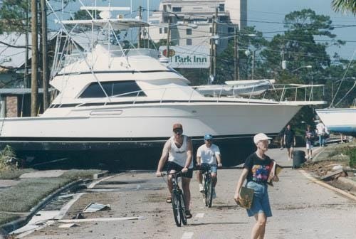 A cabin cruiser lies across U.S. Highway 98 in downtown Fort Walton Beach in the aftermath of Hurricane Opal, which struck in October 1995. [ DAILY NEWS FILE PHOTO ]