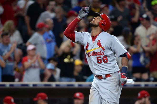 St. Louis Cardinals' Jose Martinez points to the sky while nearing home after hitting a home run during the seventh inning of a baseball game against the San Diego Padres pm Tuesday, Sept. 5, 2017, in San Diego. (AP Photo/Orlando Ramirez)
